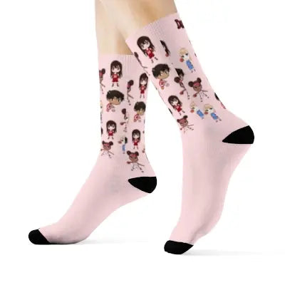 A pair of pink Duntalk "Baby Gurl" girl's basketball socks with cartoon characters.