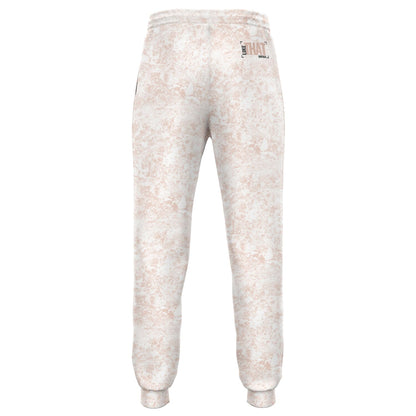 White joggers with pink mud print, pockets, and string for waist. Words on the back right side saying "Like That Duntalk" in black and pink