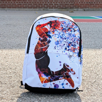 Backpack with colorful design on a pavement background