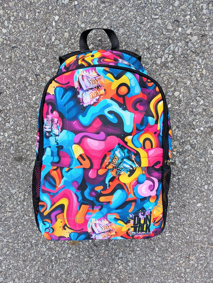 Colorful backpack with abstract design on a gray pavement background