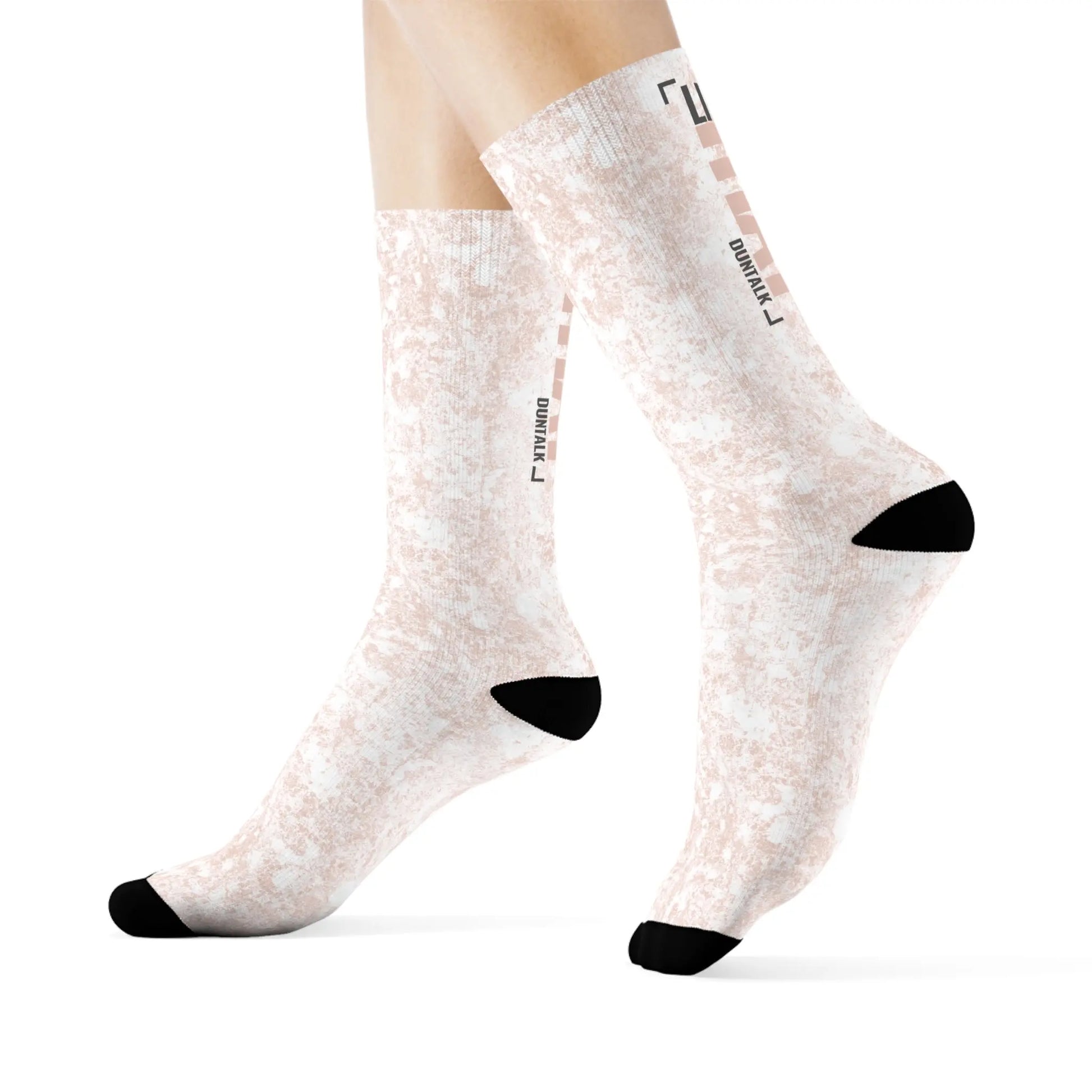 White socks in pink mud print with words on the back of each sock saying "Like That Duntalk" gray and pink