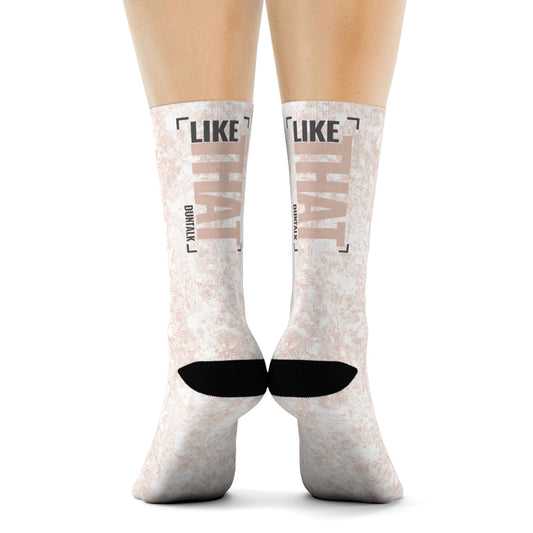 White socks in pink mud print with words on the back of each sock saying "Like That Duntalk" gray and pink